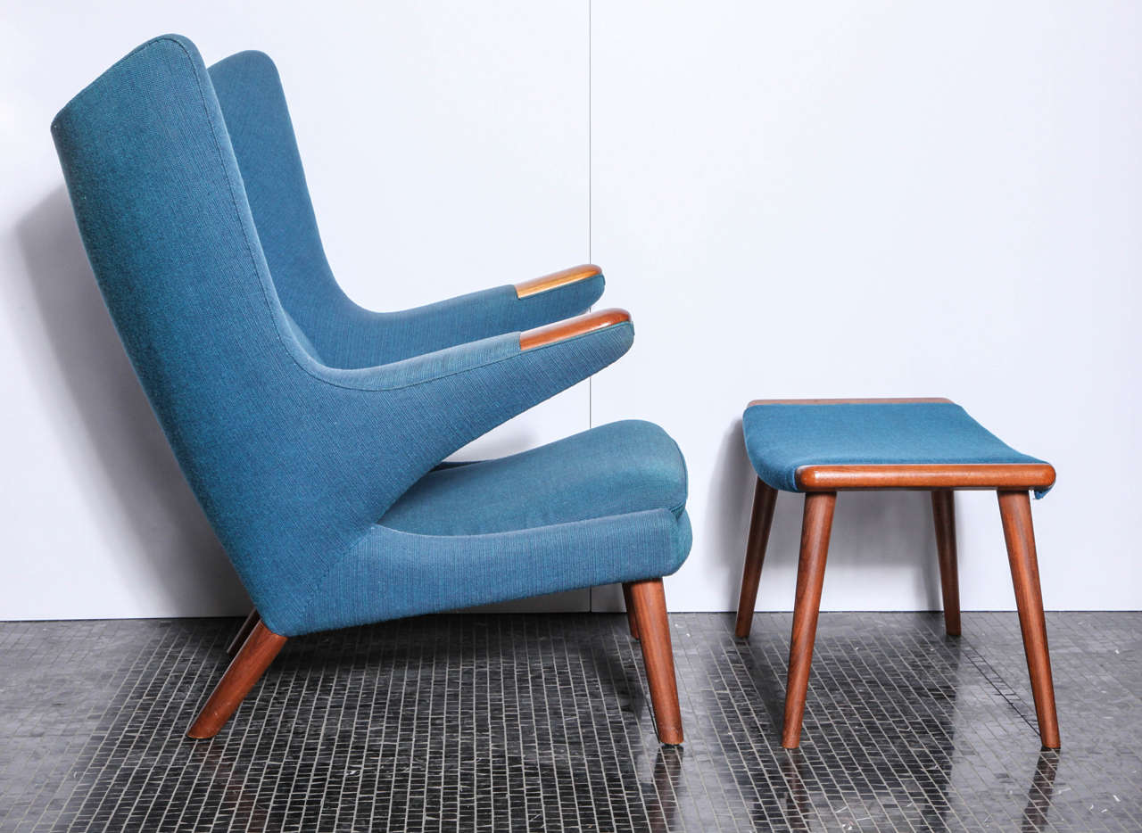 An all original papa bear chair and ottoman by Hans Wegner upholstered in a teal blue fabric. Marked underneath 