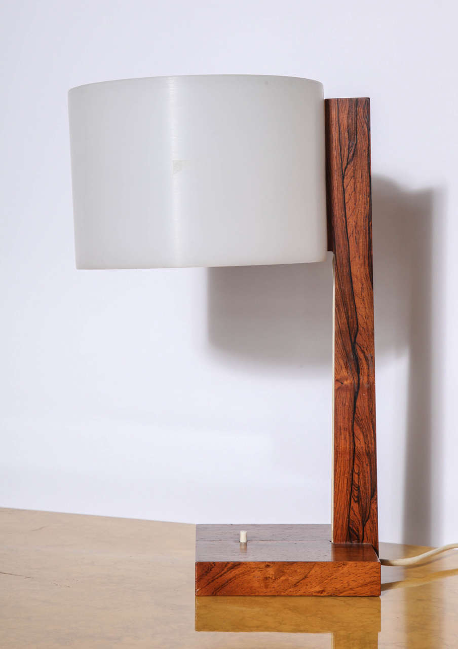 Rosewood desk lamp with plastic shade, marked Luxus, Sweden.