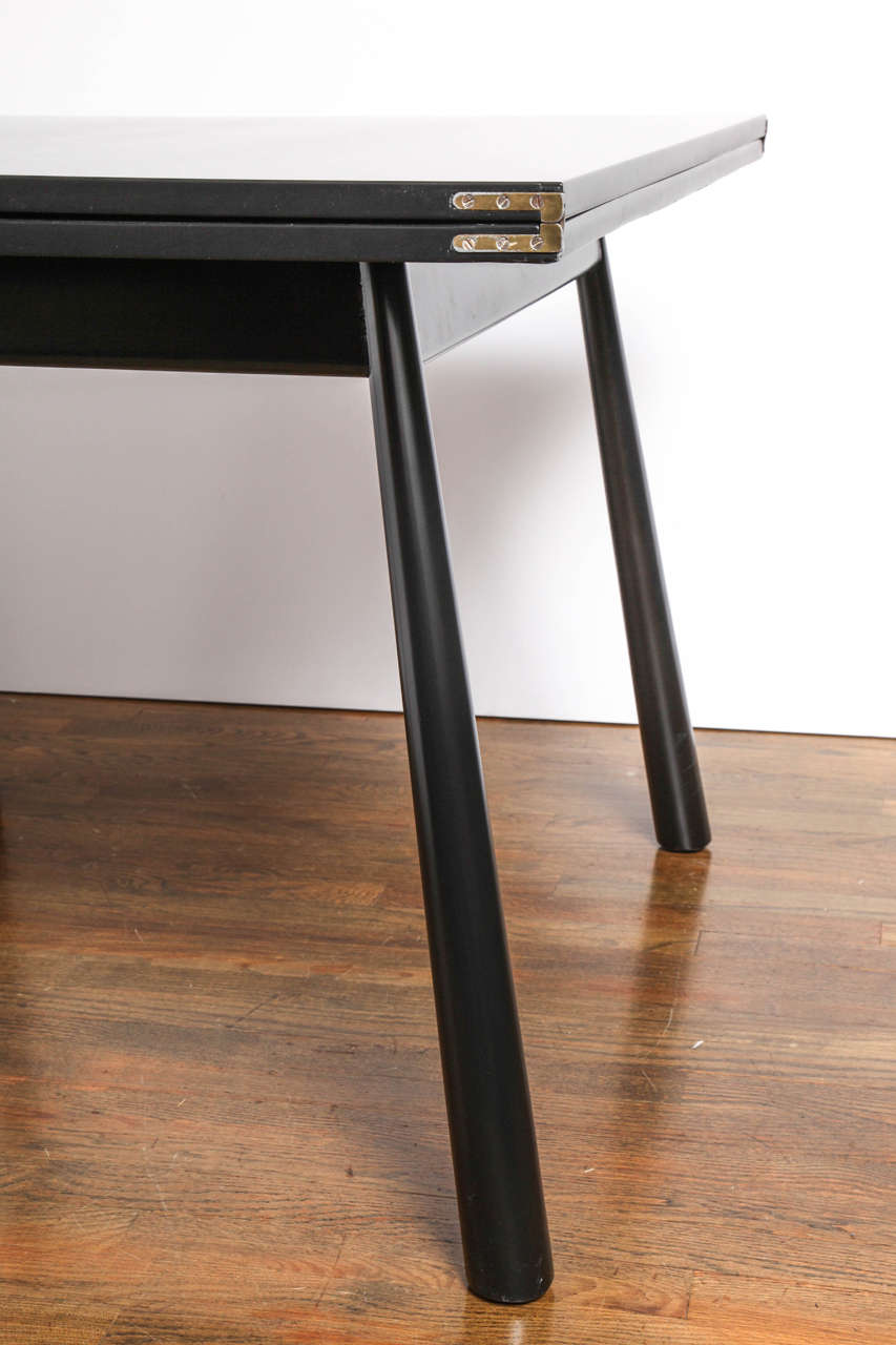 Mid-20th Century Black Lacquered Flip-Top Dining Table by T.H. Robsjohn Gibbings