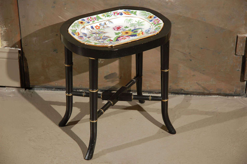 An Early 19th Century Ironstone China Platter, mounted as a Table on a later Ebonized Bamboo Stand.  Mark on platter is 