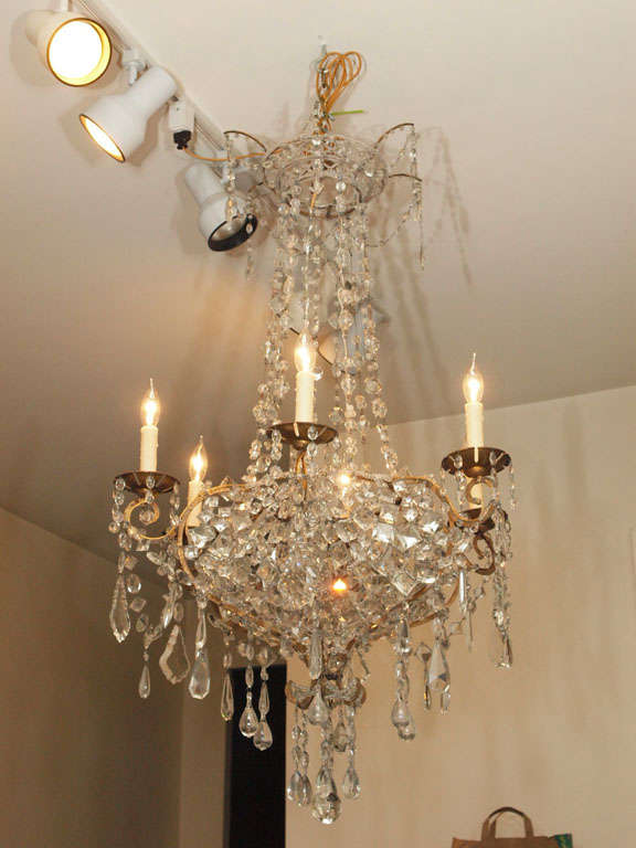 18th century basket shaped chandelier with gilt iron frame and crystal dressing