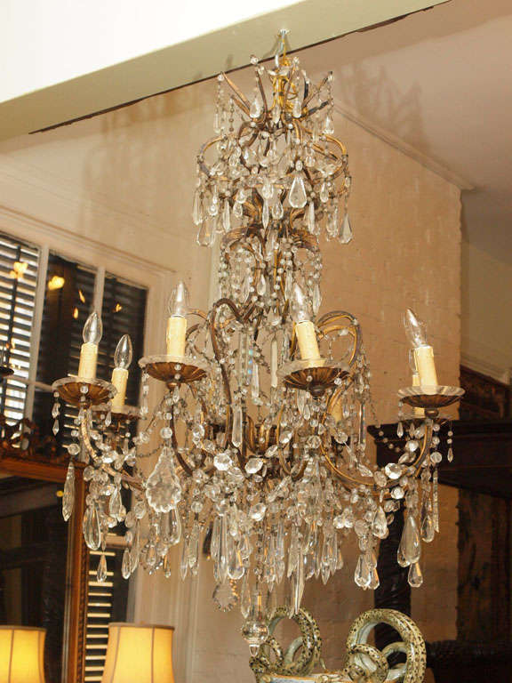18th century gilt iron and crystal chandelier with crowned top and both iron and crystal bobeche