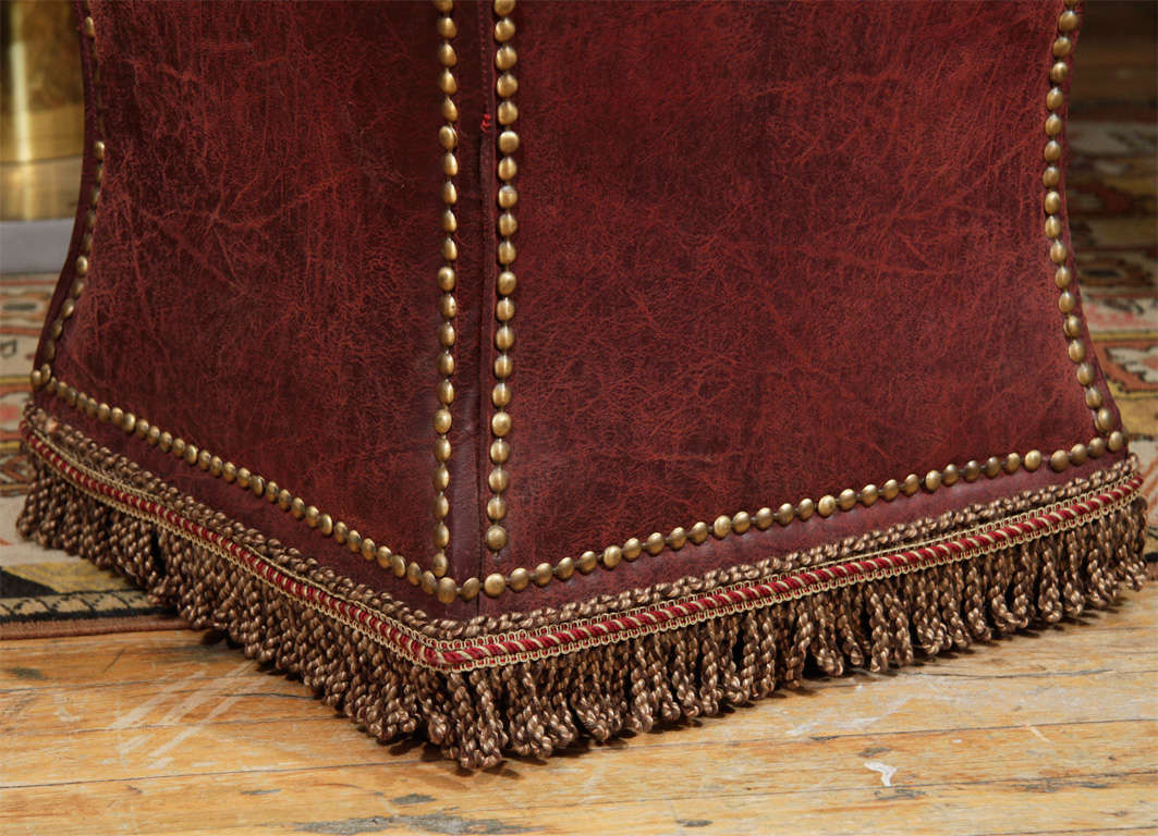American Vintage Distressed Leather Ottoman with Nailhead Detailing