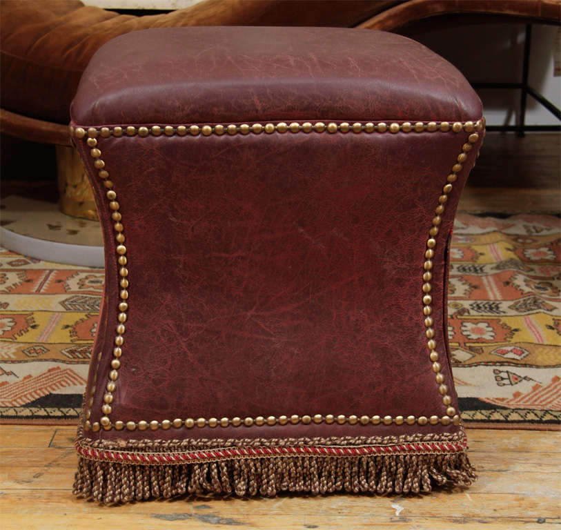 20th Century Vintage Distressed Leather Ottoman with Nailhead Detailing