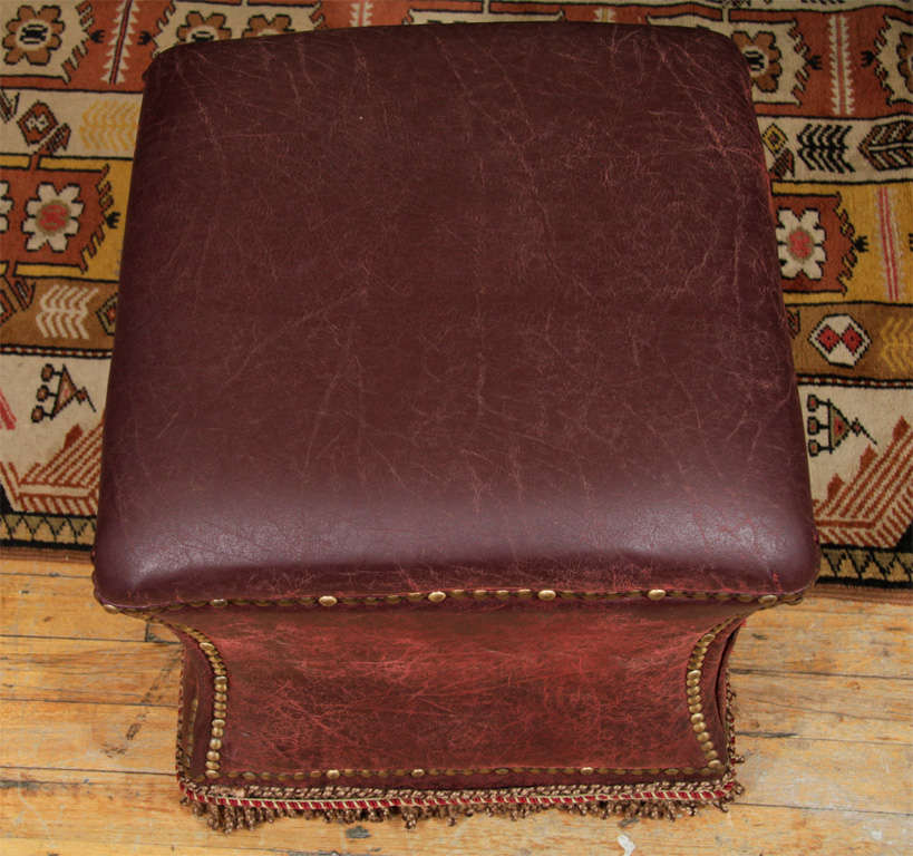 Vintage Distressed Leather Ottoman with Nailhead Detailing 3