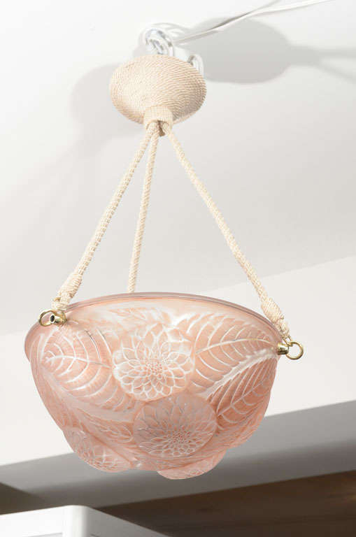 #2459, Designed in 1921 and executed post 1945, Clear and frosted with a sepia stain (looks rose colored). Moulded Lalique once and France twice. Three interior little lights. Cream satin cord.