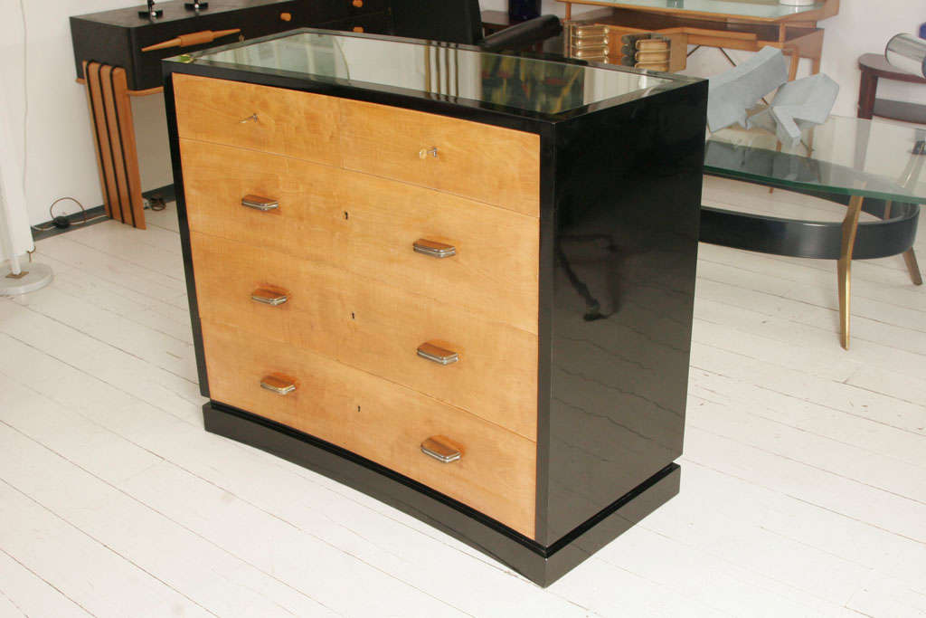 Curved chest of drawers.