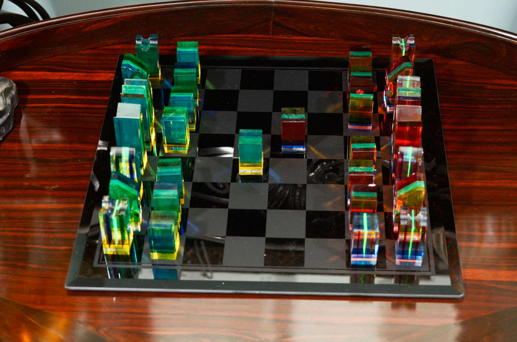 A Very cool Modern lucite chess set designed by Charles Hollis Jones. with chess pieces all done in acrylic. Chess pieces range from 4