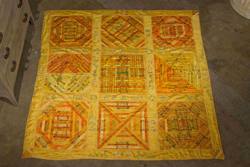Cigar quilt of silk bands and with embroidered art work.