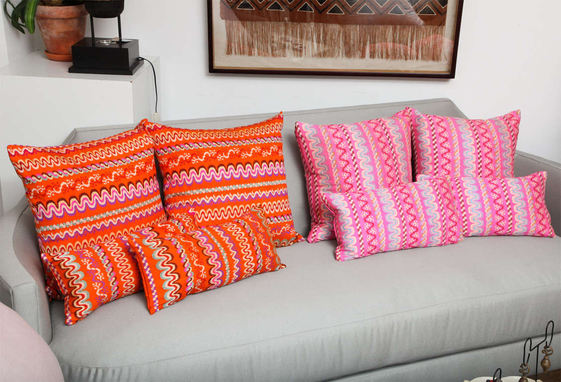 Burmese throw pillows in colorful patterns. Available in pink, orange and light green. Sizes vary. Largest dimensions and price shown below.