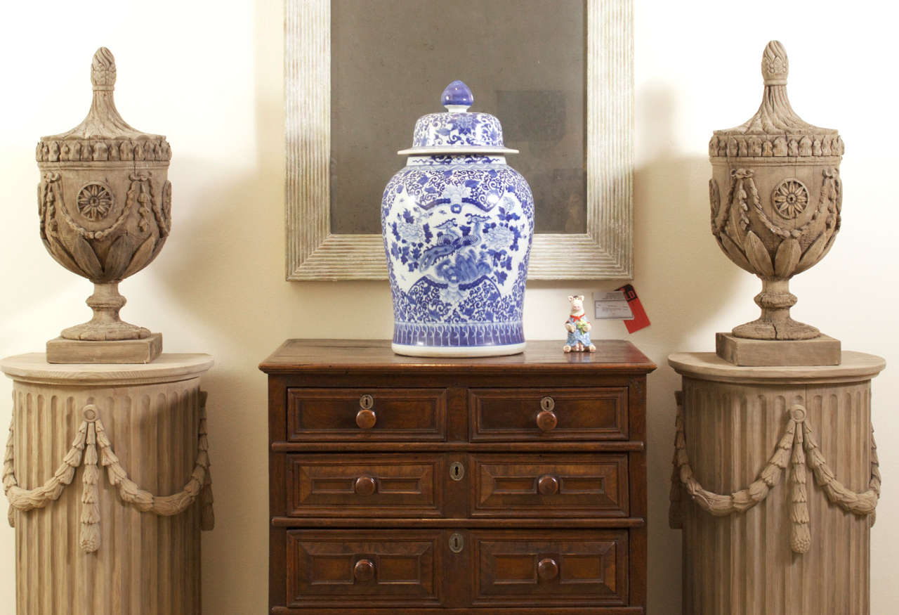 A Pair Of Wood Urns