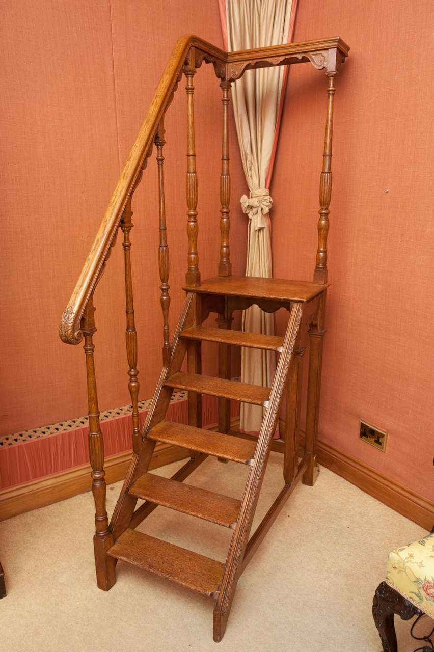 An important set of library steps made in oak for Gonville Caius College, Cambridge, circa 1840. Of fine golden color they display in all carved elements the hand of ecclesiastical as well as secular craftsmanship typical of the first half of the