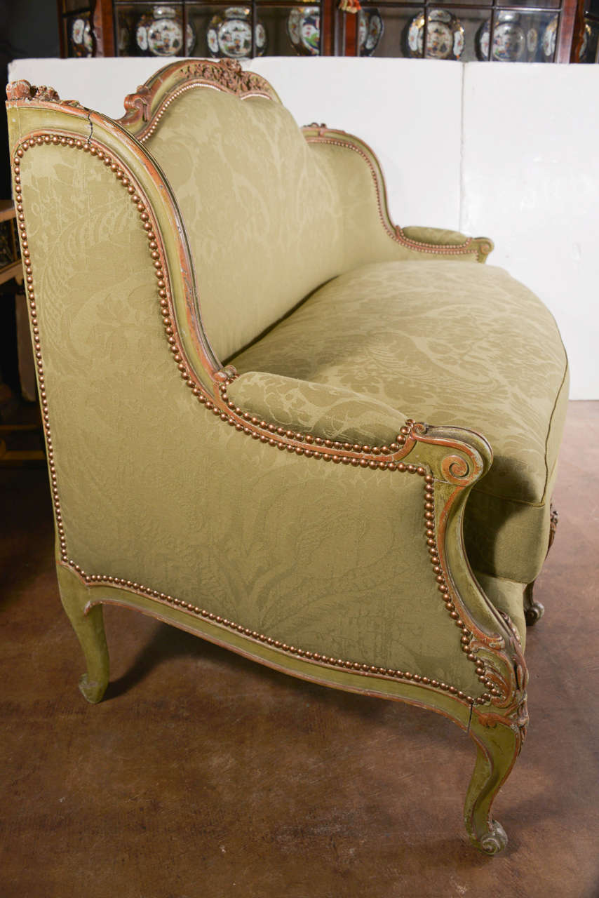 Louis XV style settee in painted wood with light green finish, upholstered in light green wool damask, circa 1880