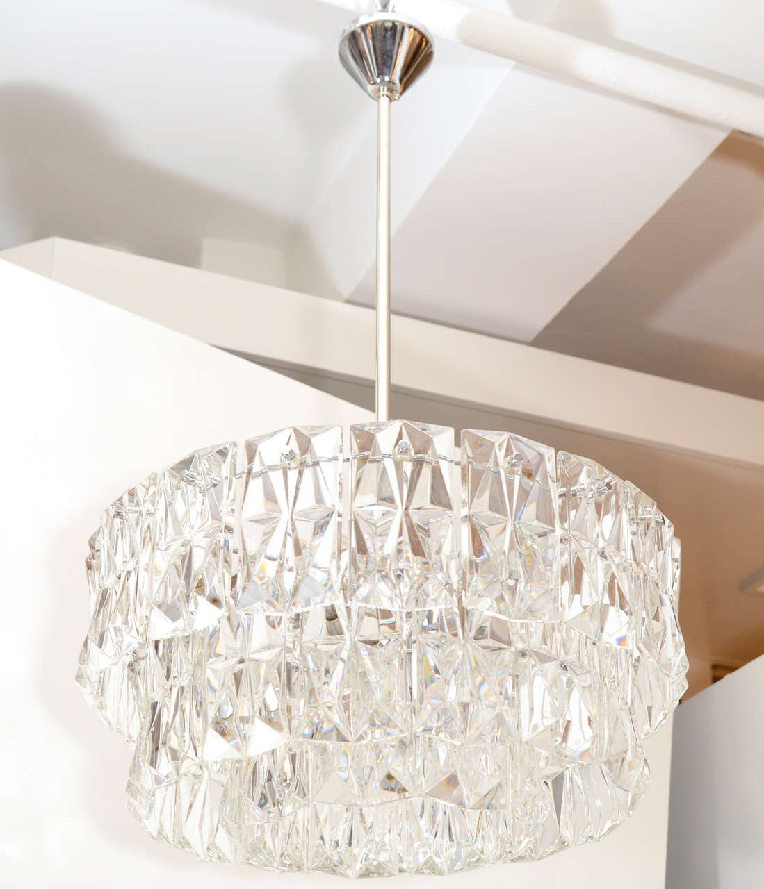 Exceptional 3 tier chandelier composed of deep cut rectangular shaped crystal prisms.