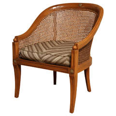 A Neoclassical Fruitwood Caned Bergere