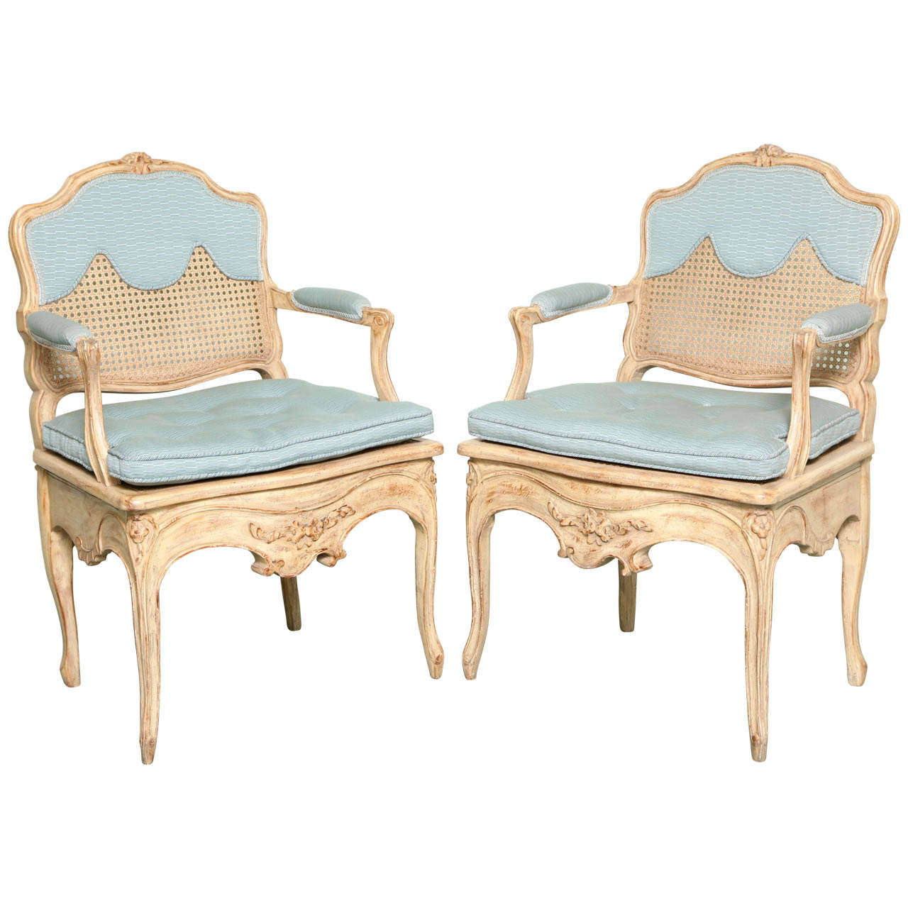 A Pair of Louis XV Style Caned and Painted Armchairs