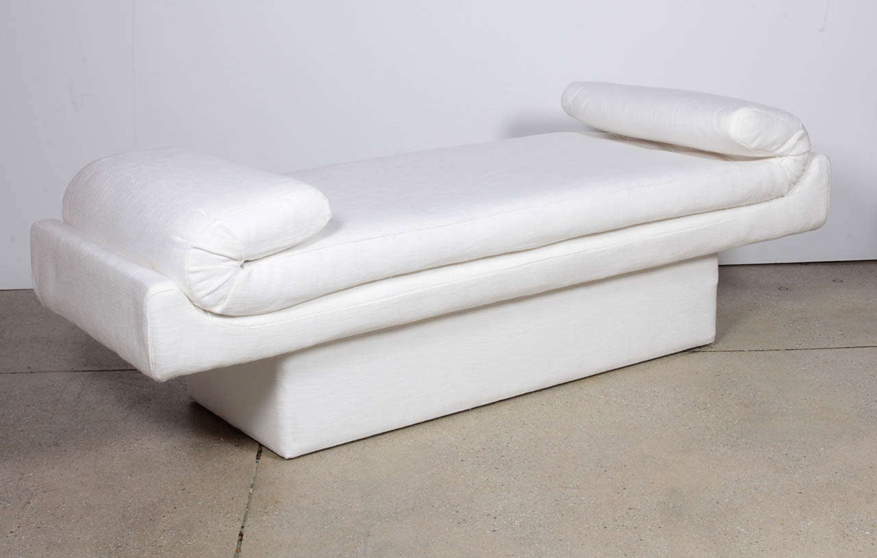 Unique and and glamorous lines shape this mid century upholstered bench. Perfect for any room ... at the end of a bed, by a window, foyer or on its own.   Curved arms over a solid base.  Expertly restored and reupholstered in Belgian White Linen.
