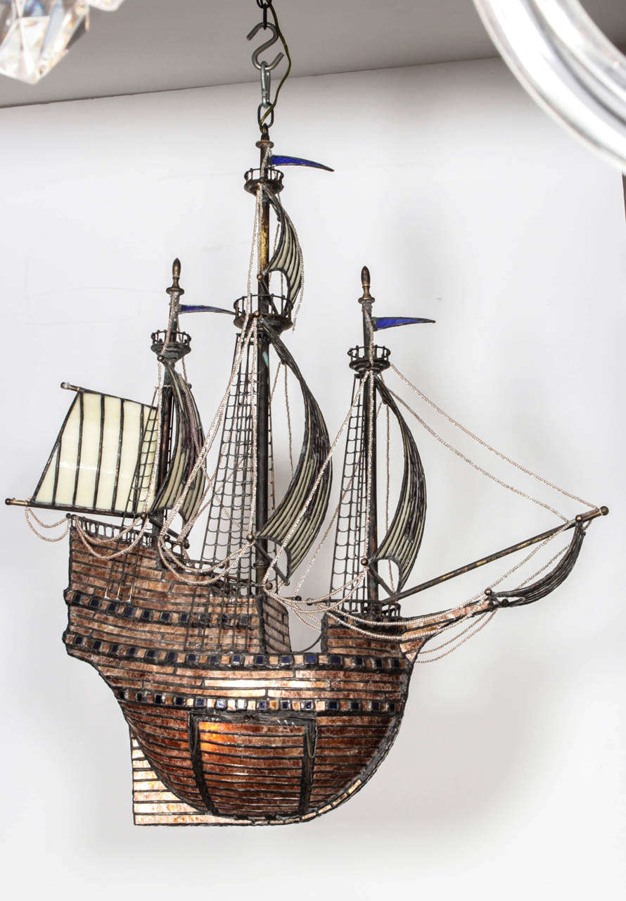 The Snedegar ship light fixture by sculptor Adam Kurtzman. USA, late 20th Century. Hand made of inlaid glass and Mica on metal frame and illuminated.  Wired for U.S.; takes two standard bulbs, 60 watts max. 