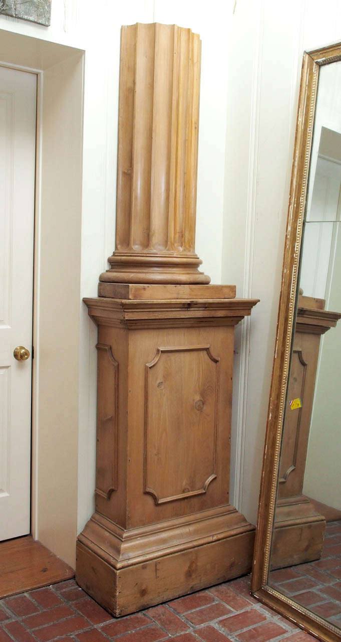 A Georgian style pine pedestal with column. It comes in two parts, 20th century, English.
