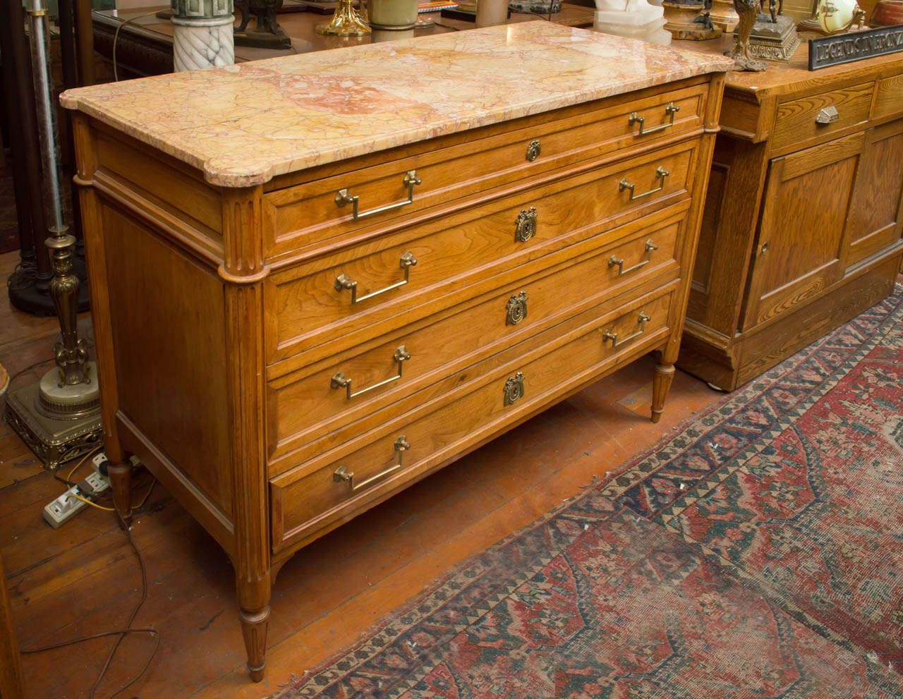 This very high quality French bureau has some of the nicest grain and colored marble you will find on a piece of furniture.  The marble is original and has no repairs.  The chest of drawers is made of walnut and has all the original brass handles