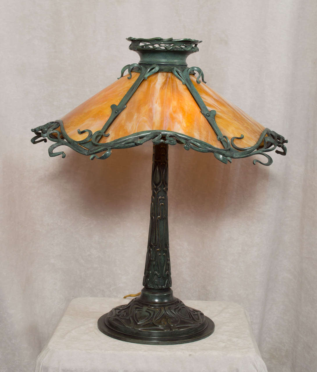 This highly unusual panel style lamp offers the highest quality workmanship that can be performed.  We guarantee this lamp to be by Gorham, known for making sterling silver, casting bronzes, as well as high quality lamps.  The rich dark green patina