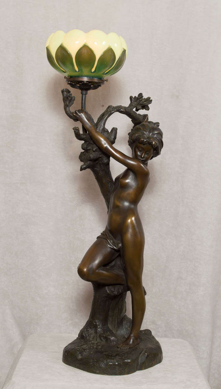 This is a magnificent example of art nouveau sculpture with the added benefit of it lighting up.  The simplistic beauty of art nouveau's return to nature theme is the reason that people are still drawn to it.  This is an original, unusual period