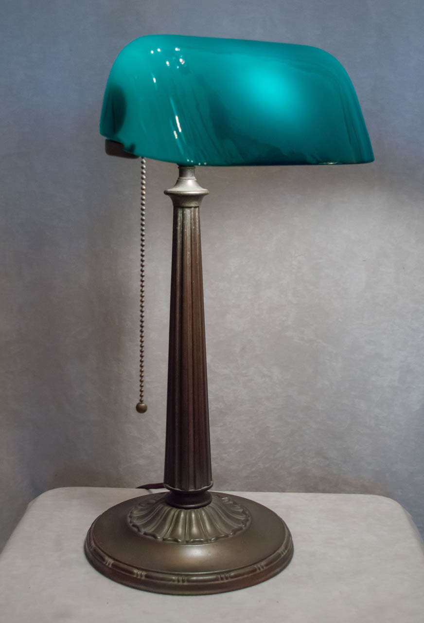 Emeralite is the most noted maker of these desirable and handsome desk lamps.  Watch any movie pre-1950's and I bet you'll see one of these on the executive's desk.  These are practical and beautiful.  This shade retains a good portion of the