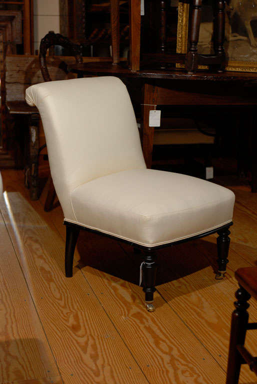 Two English Slipper Chairs with castors, one slightly larger. Priced seperately.
