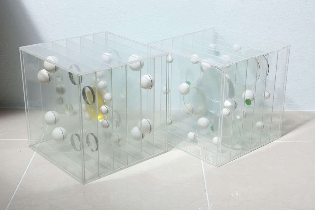 The Lucite boxes with floating elements suspended by further Lucite pieces, signed and dated Franco Scuderi, 1982.