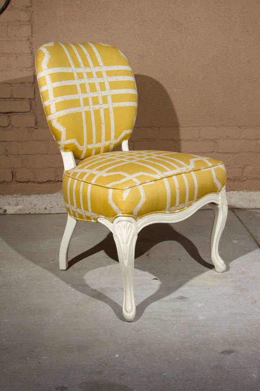 Italian carved frame side chair featuring Thomas Paul lattice motif upholstery and white lacquer cabriole legs.