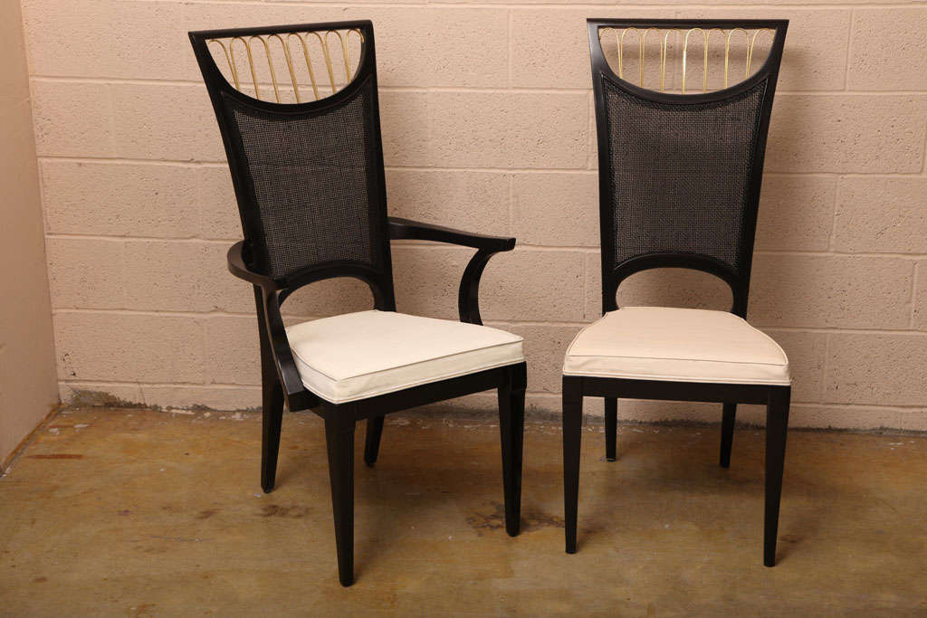 Set of Six Dining Chairs by Romweber featuring elegant curved backs with cane webbing inserts and decorative gilt pattern.
Recently restored. New black patent leatherette cushions.
Note that the photos still show the original white cushions.