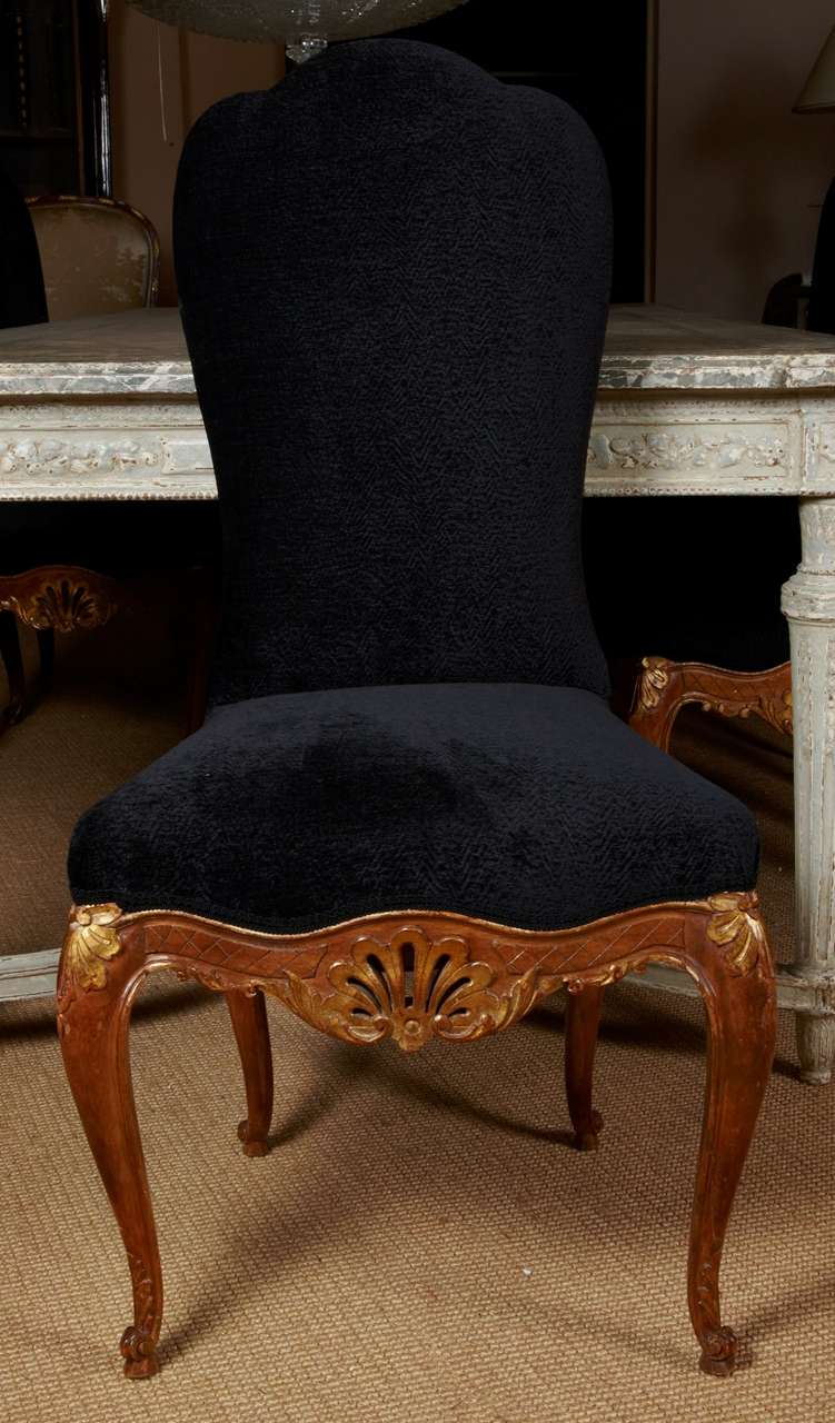Set of 8 gilt patinated richly sculpted oak wood chairs by Jansen, upholstered with Donghia astrakan Ebony fabric