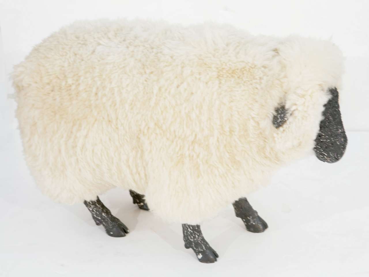 Decorative life size sheep sculpture with real sheepskin on resin body.