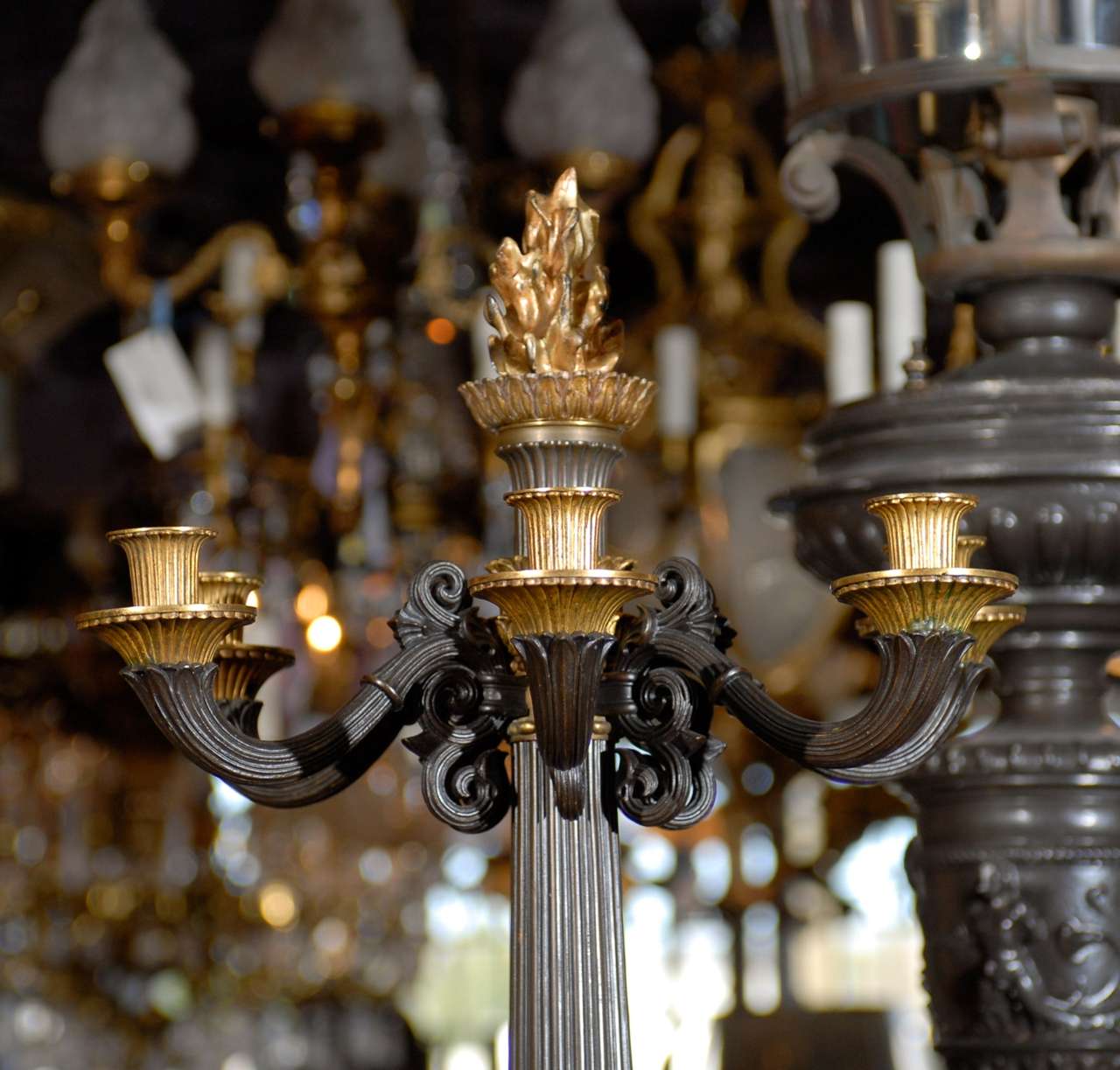 Incredible pair of Empire style candelabra of gilt and patinated bronze. The backs are flat in order that they might be close to a wall. 