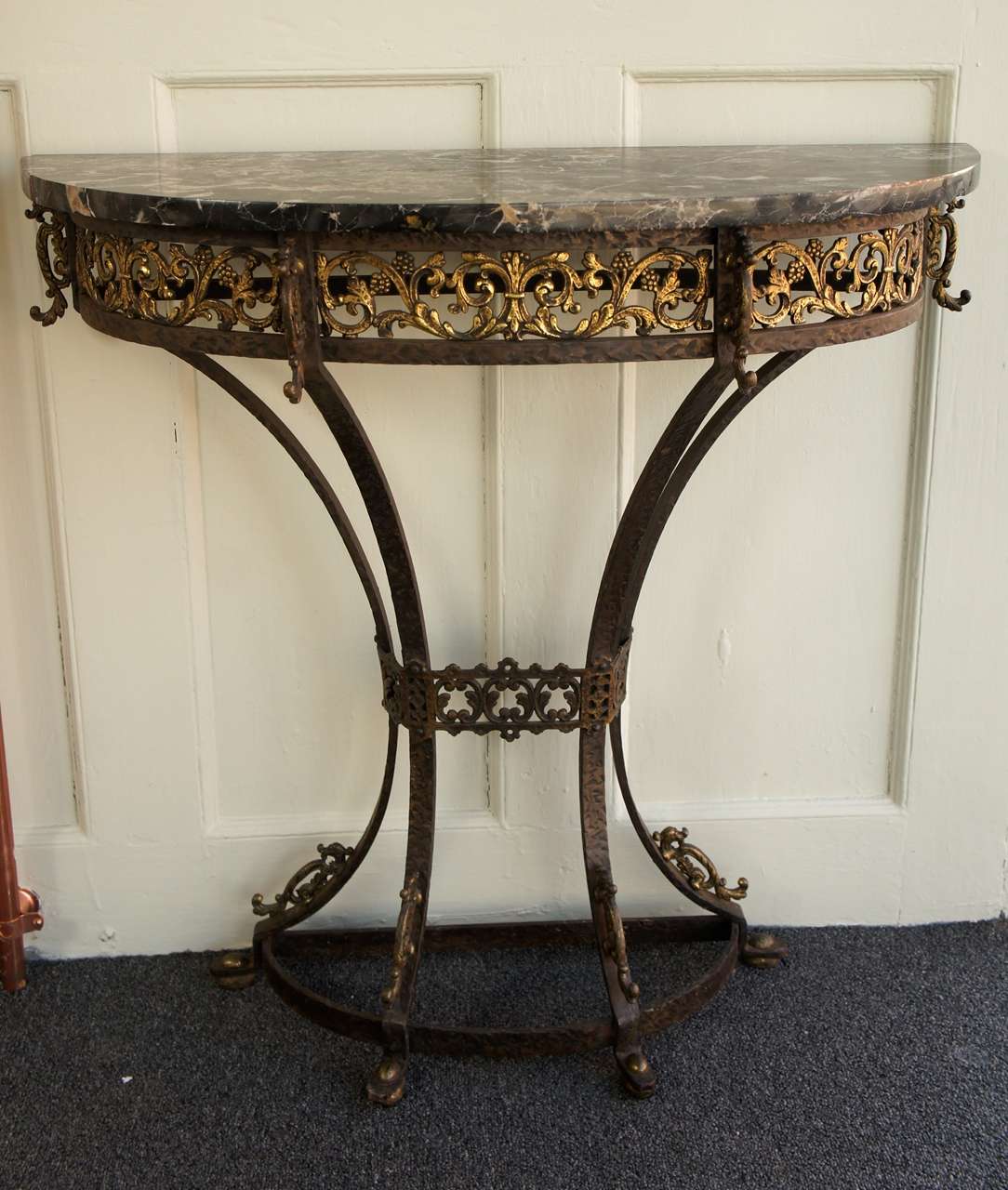 Petite console table, with hand-forged iron structure and brass filigree work. Original Egyptian marble top with strong veining.