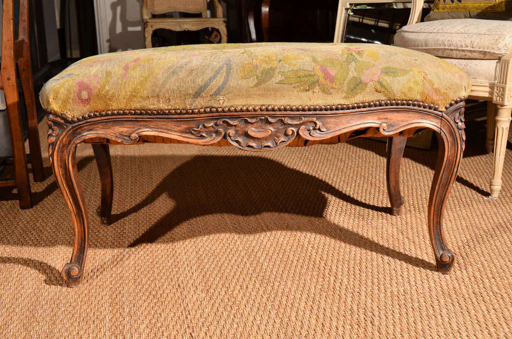 Charming bench with original needlepoint upholstery.