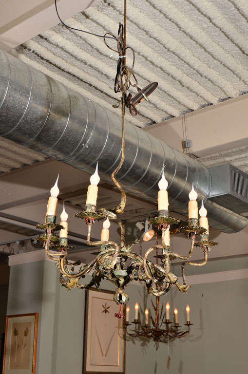 9-light gilt bronze chandelier with beautiful patina, in the organic style of Bagues, 1930's France.
