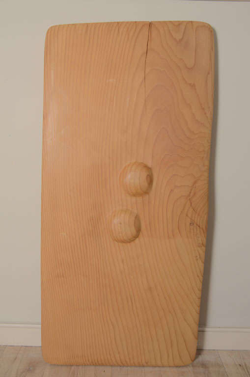 A carved panel of California Redwood with a pair of sensual bumps in relief. The wood is extremely smooth and lightly waxed with a few natural cracks which happened organically.
Custom mounted on a bronze mount for wall hanging.