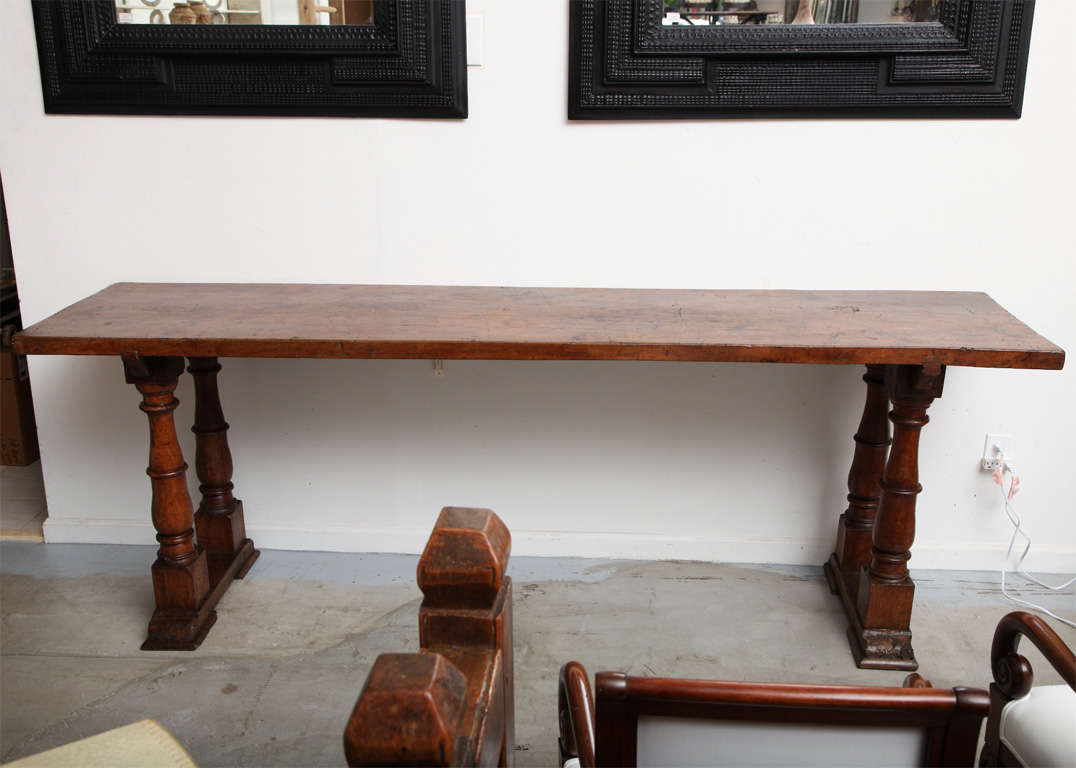 Long console on column legs