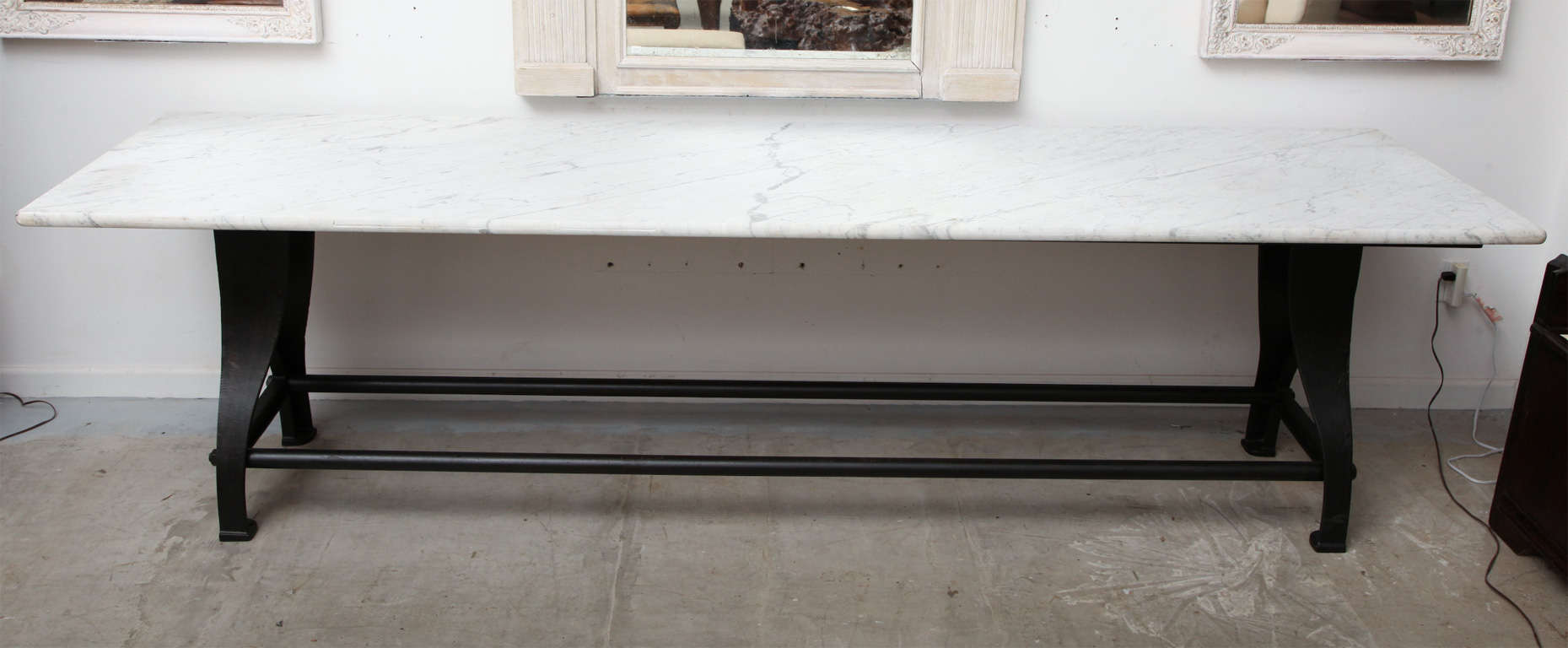 Honed carrera marble top on industrial iron base