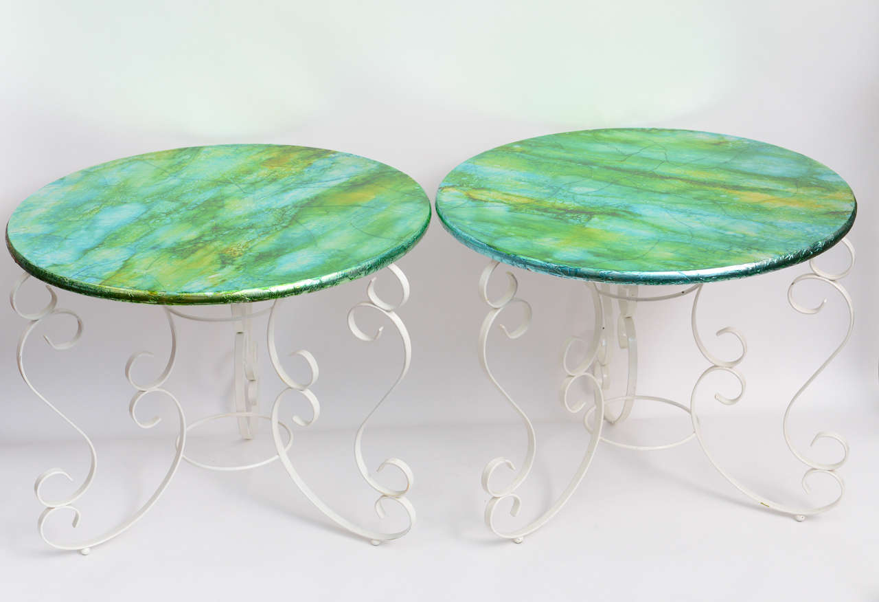 The tops of these 1960s glamorous side tables have been transformed to capture the colors of summer. The blue of the sky, green of the grass and the golden yellow of the sun marble together in this exquisite aluminium foil with polyurethane coats.