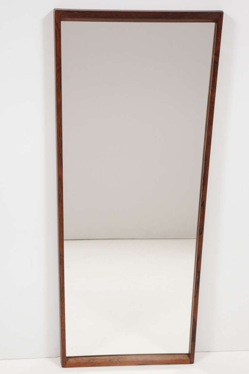 Vintage 1960s Rosewood Rectangular Mirror by Aksel Kjaersgaard

This Wall Mounted Mirror is in excellent, like-new condition and have high quality, original, mirrors in them. Long enough to see clear full body reflection if standing at the right