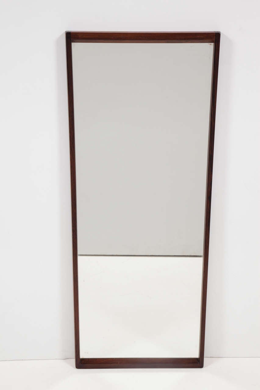 Vintage 1960s Rosewood Mirror by Aksel Kjaersgaard

This Wall Mounted Mirror is in excellent, like-new condition and have high quality, original, mirrors in them. Long enough to see clear full body reflection if standing at the right distance.