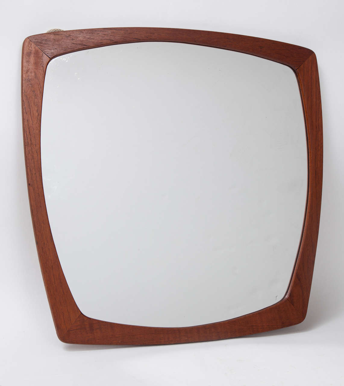 Vintage 1950s Danish Teak Mirror 

This Retro Mirror is in excellent condition and is a great addition to a Country, Eclectic, Modern, or Atomic room. Definitely more decorative than functional, but definitely a piece of history. Ready for pick