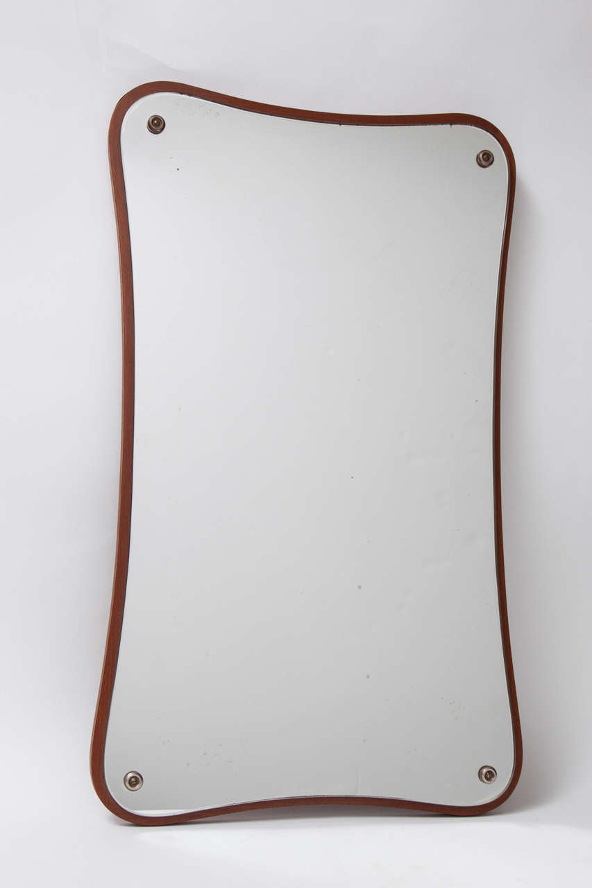 Vintage Shadow Box Danish Modern Mirror

This Retro Mirror is in excellent condition and is a great addition to a Country, Eclectic, Modern, or Atomic room. Definitely more decorative than functional, but definitely a piece of history. Ready for