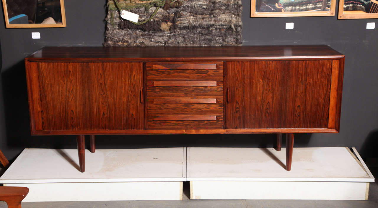 Vintage 1960s Danish Sideboard by Henning Kjaernulf 

This Multi-Purpose Cabinet is in excellent, like new condition. Each side closes with a tambour door. A tambour door is a sheet of veneer over canvas and slides front to back on a track; very
