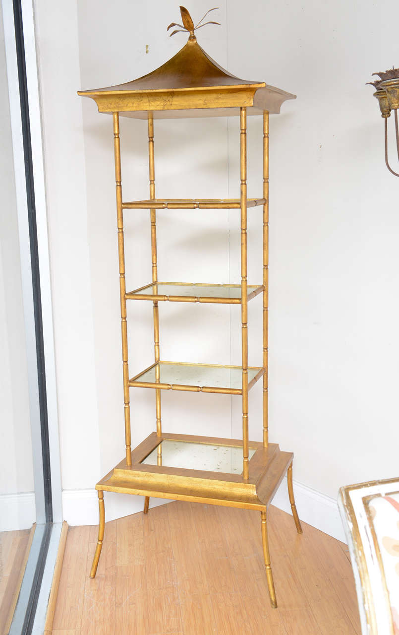 Charming four-tier gilded pagoda etagere with mirrored shelves.