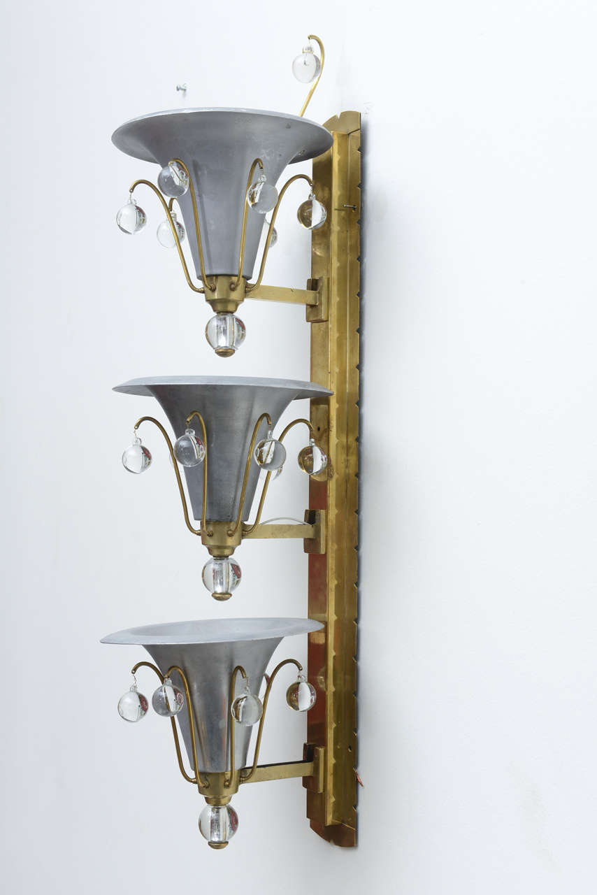 Chic pair of vintage Art Deco aluminum and brass sconces with glass ball accents.