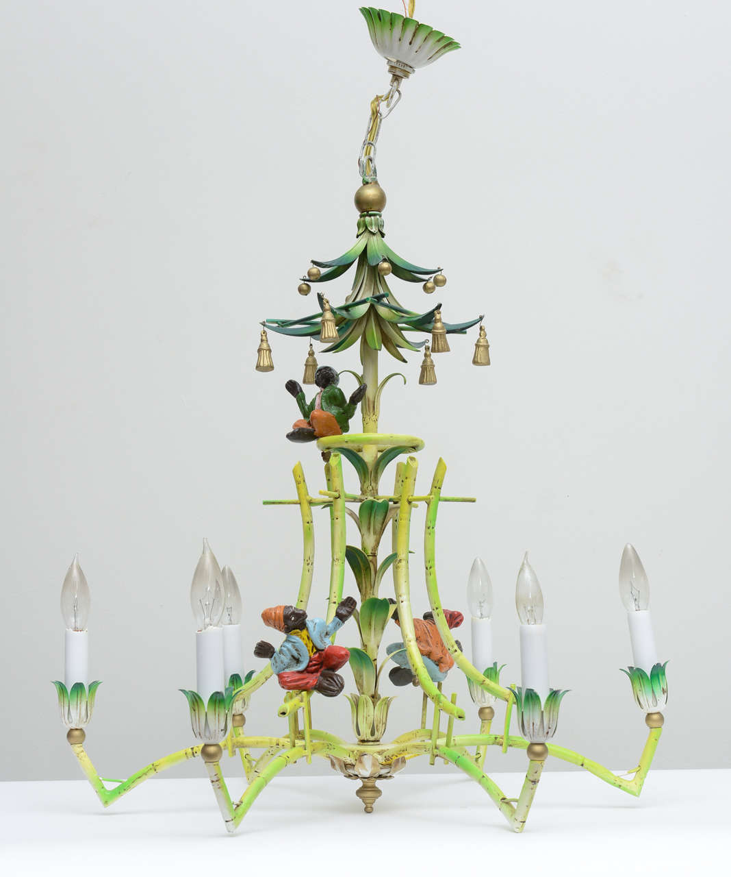 Palm Beach style faux bamboo metal chandelier with fanciful monkeys perched in various places.
