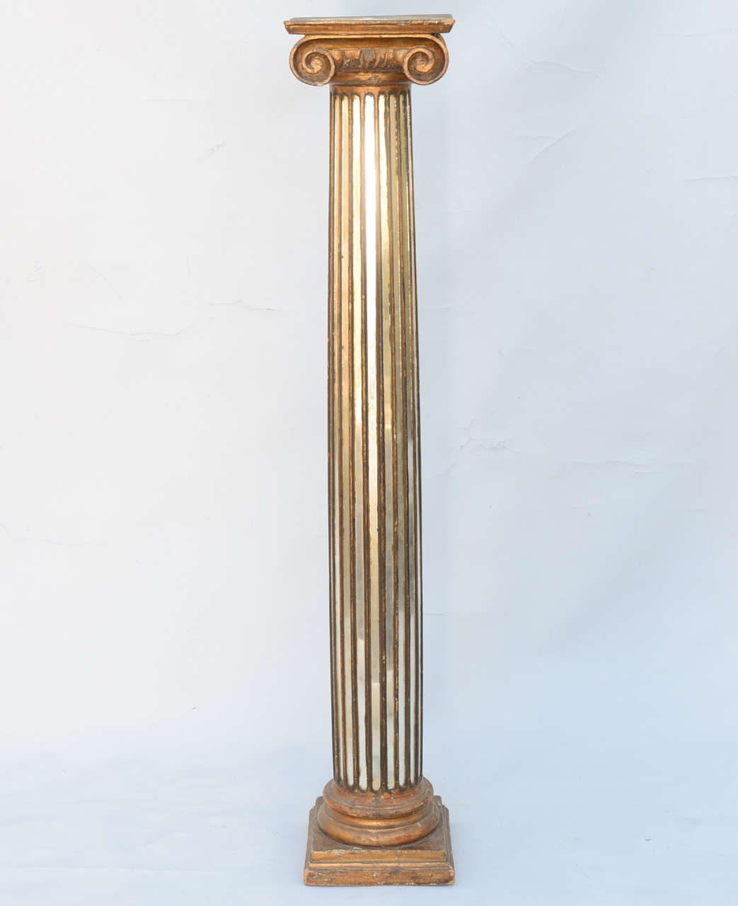 Pedestal, having fluted wood column with mirrored inserts, surmounted by carved wood Ionic capital and square platform.

Stock ID: D9220